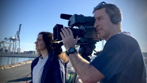 cameraman filming interview in the port of Alicante