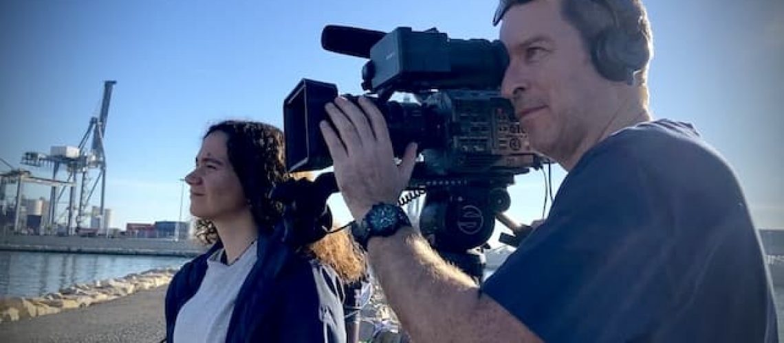 cameraman filming interview in the port of Alicante